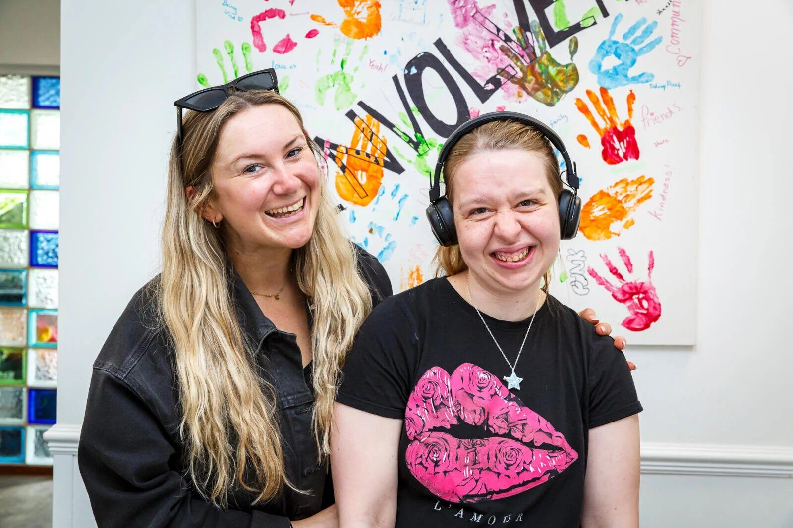 Participant and support worker enjoying art together